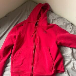 Red men’s jordan hoodie sweater.
